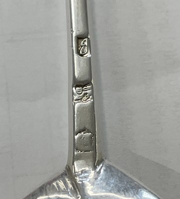 Lot 282 - A James I silver seal top spoon having a fig...