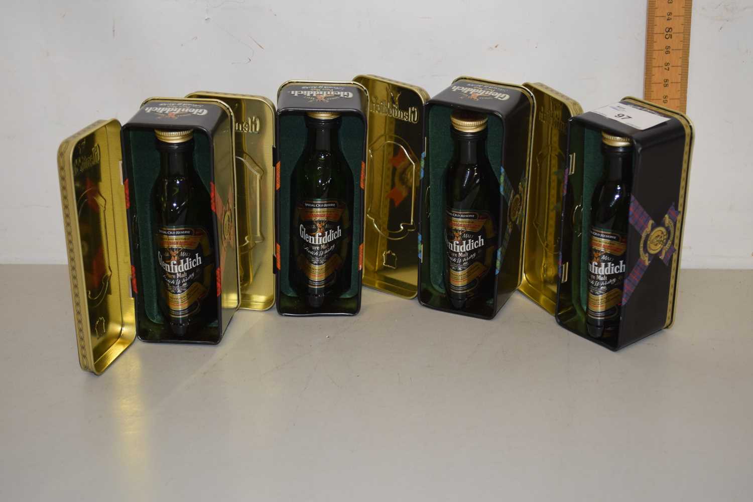 Lot 97 - Four miniature cased bottles of Glenfiddich...