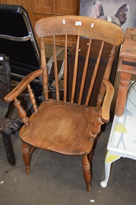 Lot 718 - A pine stick back chair