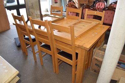 Lot 720 - An extending dining table and six chairs