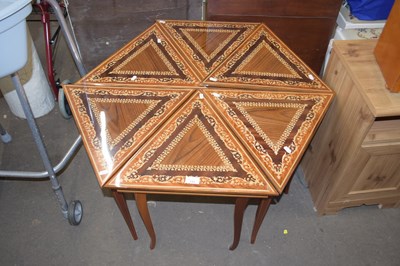 Lot 733 - A hexagonal triangle section inlaid coffee table