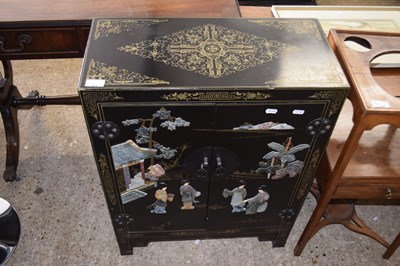 Lot 405 - Modern Chinese black lacquered two door cabinet