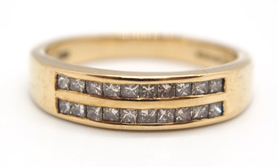 Lot 35 - A 9ct diamond ring, set with two rows of small...