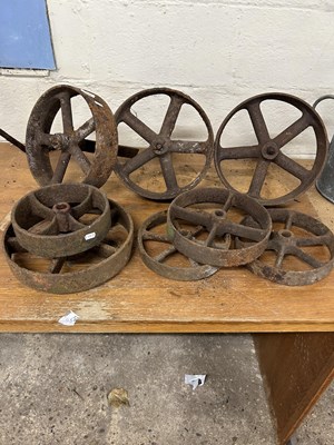 Lot 1009 - Mixed lot of eight various sized cast iron wheels