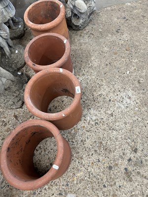 Lot 1063 - Four terracotta chimney pots