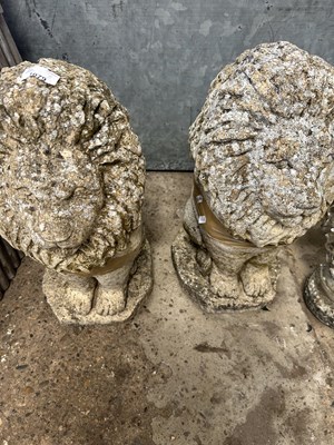 Lot 1079 - Two composite garden statues formed as lions