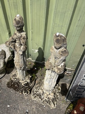 Lot 1113 - Two composite garden statues of a boy and girl