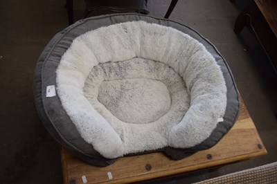 Lot 708 - A padded dog bed for a small dog