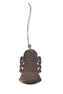 Lot 101 - A Chinese jade pendant decorated in archaistic...