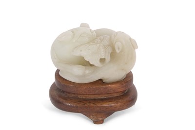Lot 103 - A jade carving of two cats and a butterfly, on...