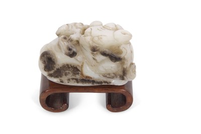Lot 110 - A jade carving of a dragon with brown...
