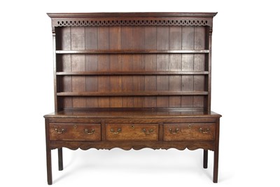 Lot 454 - A George III oak and mahogany cross banded...