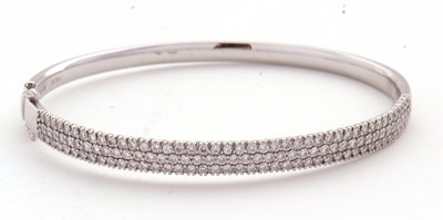 Lot 362 - An 18ct diamond bangle, the white gold hinged...