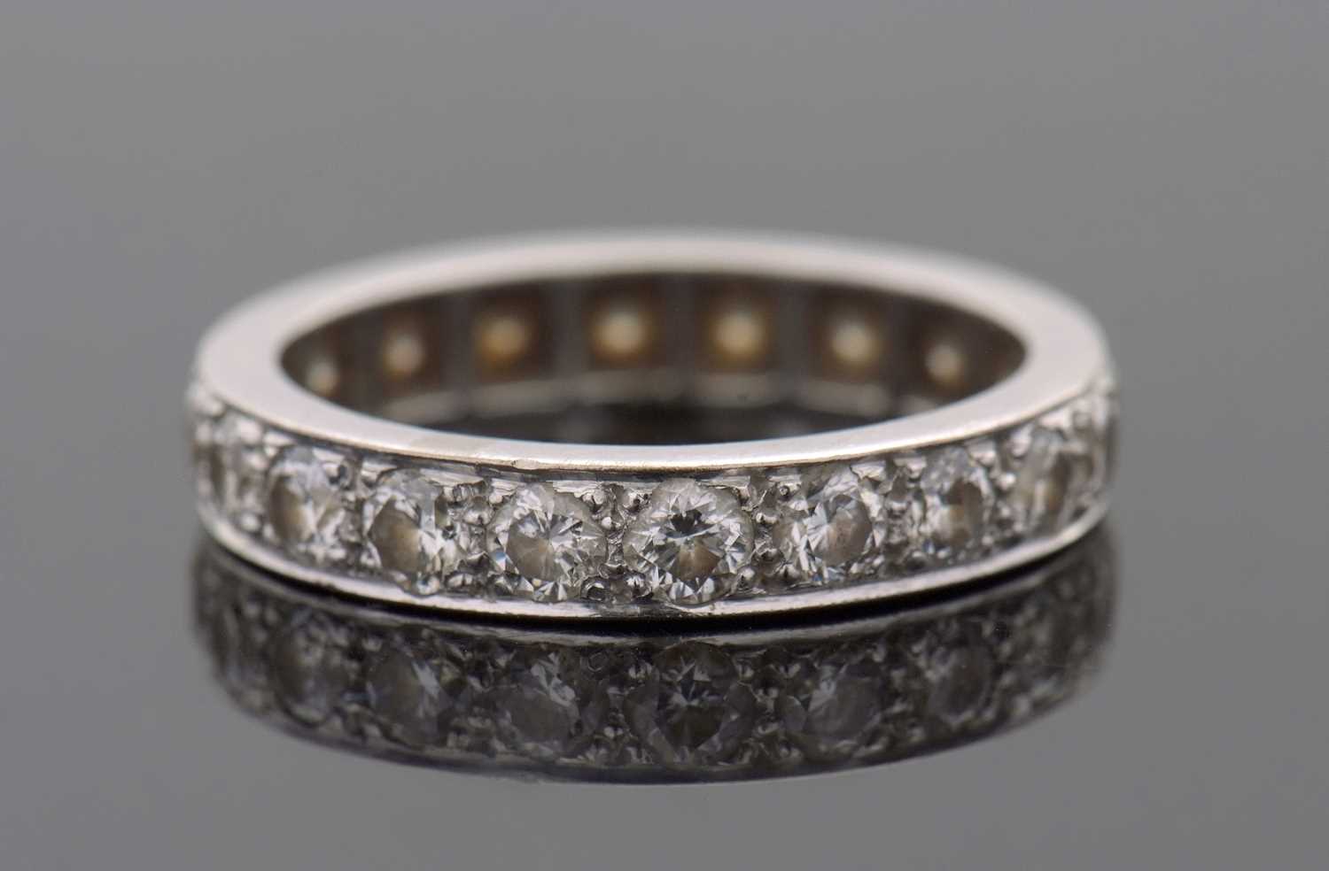 Lot 370 - A diamond eternity ring, set throughouyt with...