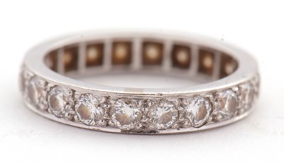 Lot 370 - A diamond eternity ring, set throughouyt with...