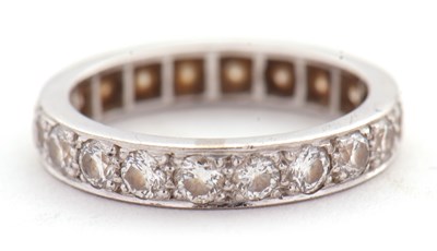 Lot 370 - A diamond eternity ring, set throughouyt with...