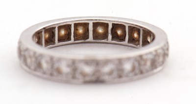 Lot 370 - A diamond eternity ring, set throughouyt with...