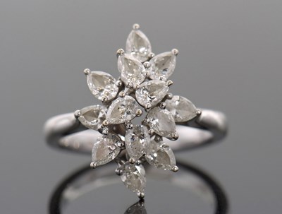 Lot 366 - An 18ct diamond cluster ring, set with twelve...