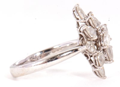 Lot 366 - An 18ct diamond cluster ring, set with twelve...