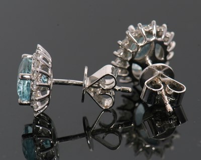 Lot 369 - A pair of 18ct aquamarine and diamond earstuds,...