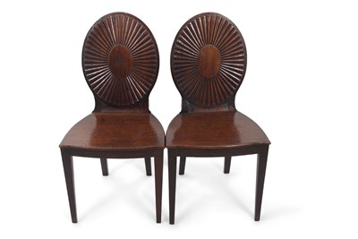 Lot 457 - A pair of Georgian mahogany hall chairs with...