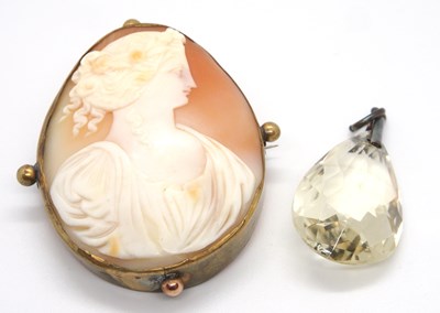 Lot 133 - A cameo brooch and a citrine colour pendant,...