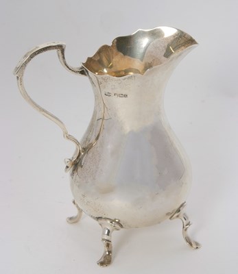Lot 7 - An Edwardian large silver cream jug of plain...
