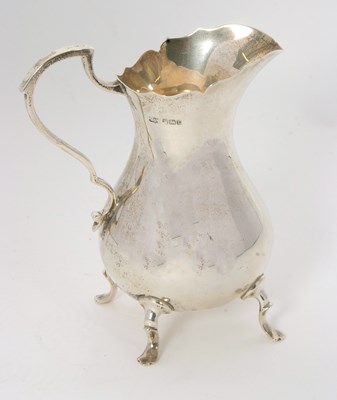 Lot 7 - An Edwardian large silver cream jug of plain...