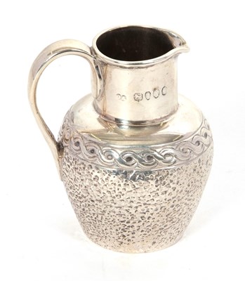 Lot 16 - A Victorian silver small cream jug with plain...