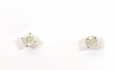 Lot 189 - A pair of 14k diamond earstuds, the round...