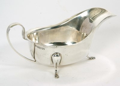 Lot 36 - A hallmarked silver sauce boat of typical form...