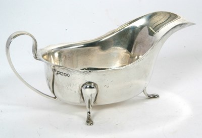 Lot 36 - A hallmarked silver sauce boat of typical form...
