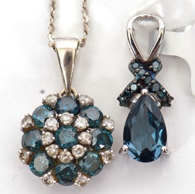 Lot 195 - A 9ct treated blue and white diamond pendant...