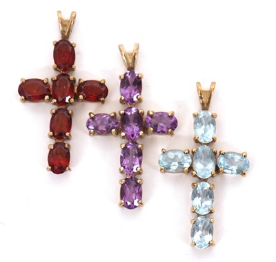 Lot 206 - Three 9ct gemset cross pendants, to include an...