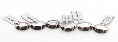 Lot 228 - Six silver and black diamond rings, the 5.5mm...