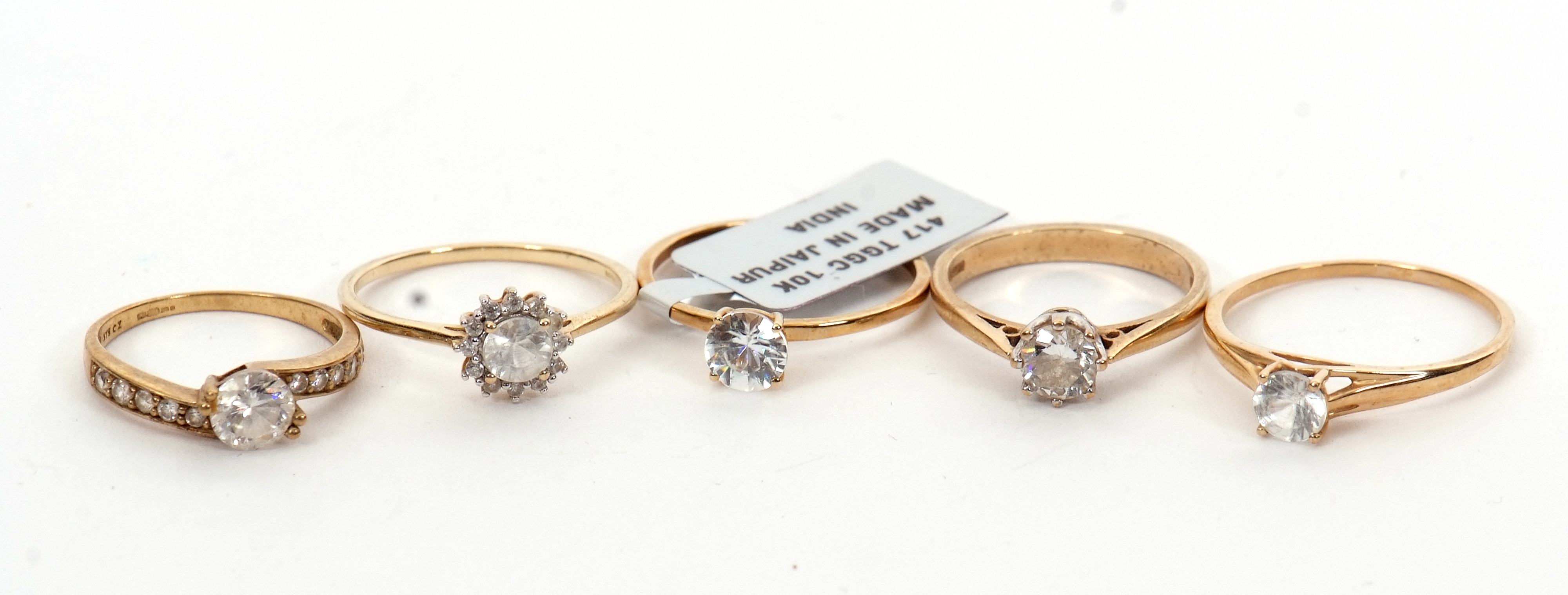 Lot 127 Five 9ct white gemset rings to include