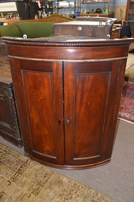 Lot 432 - Georgian mahogany bow front corner cabinet...