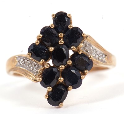 Lot 90 - A 9ct sapphire and diamond cluster ring, with...