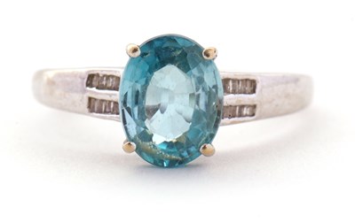 Lot 93 - A 9ct white gold topaz and diamond ring, the...