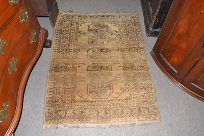 Lot 385 - A small Middle Eastern beige wool floor rug,...