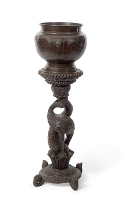 Lot 467 - A Burmese hardwood jardiniere stand with...