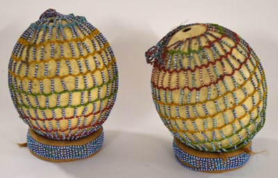 Lot 88 - Two Orstrich eggs in traditional Kenyan massai...