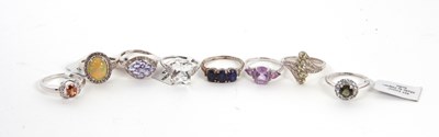 Lot 372 - Eight silver and gemset rings: to include an...