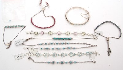 Lot 384 - A group of silver and gemset bracelets: to...