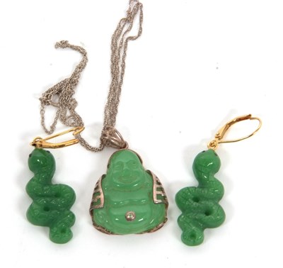 Lot 342 - A jade buddha pendant and a pair of jade...