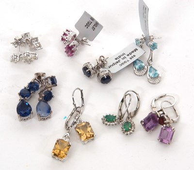 Lot 395 - Eight pairs of silver and gemset earrings: to...