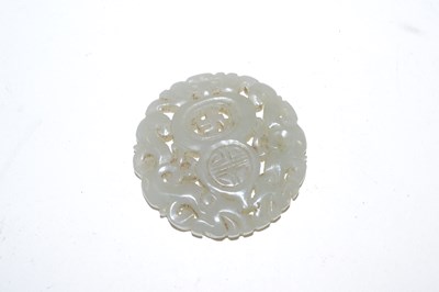 Lot 377 - A carved Chinese jade medallion, 5cm diameter