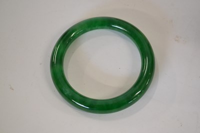 Lot 273 - A jade bangle approx. 1cm thick, inner...