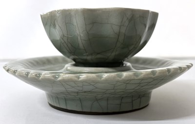 Lot 269 - A celadon ground bowl of faceted form on...