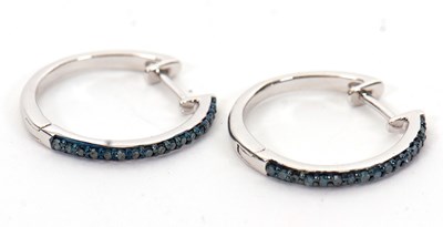 Lot 220 - A pair of silver and treated blue diamond...